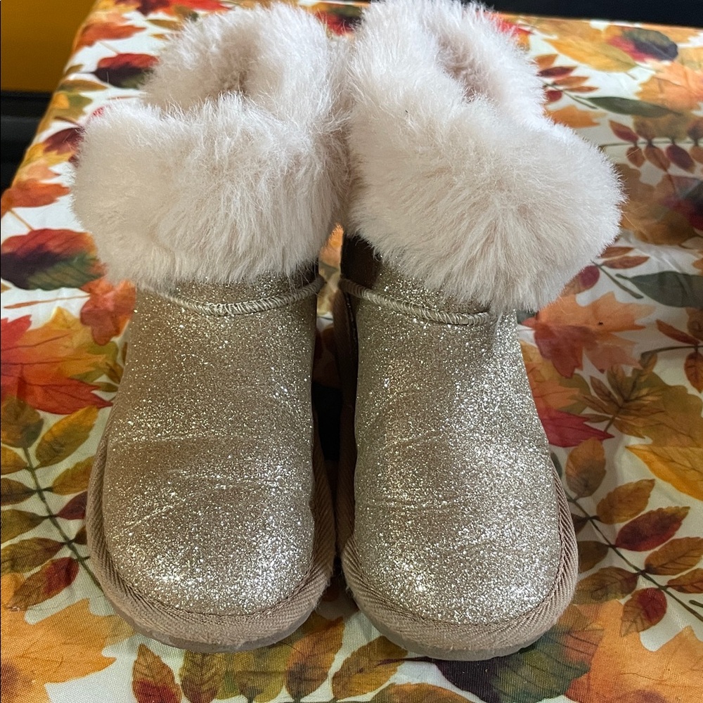 Place Glittery Gold Boots with Plush Fur